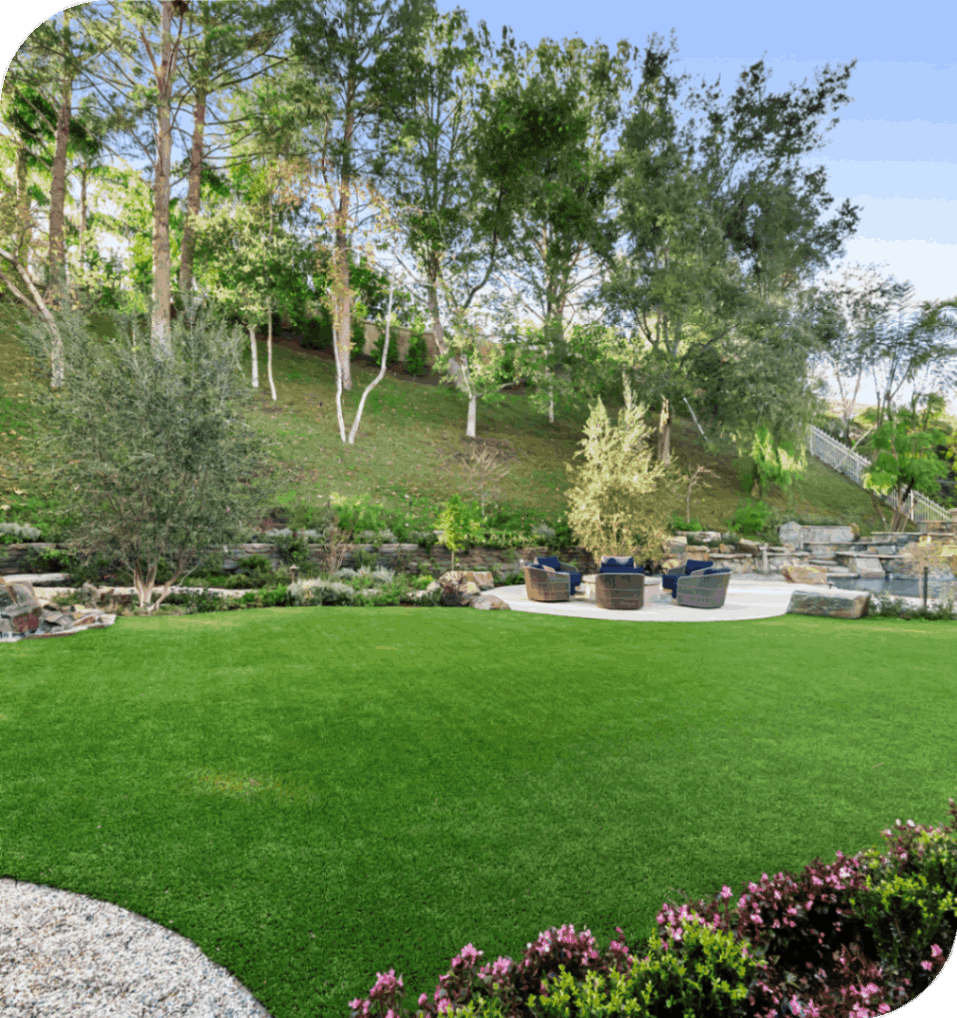 Lush backyard with patio and seating area.